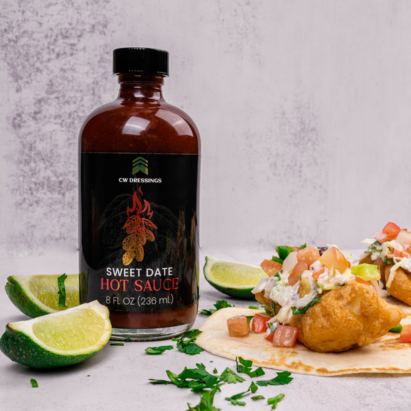 CW Dressings Sweet Date Hot Sauce; Date Hot Sauce made with 100% organic deglet nour date syrup served with fried fish tacos.